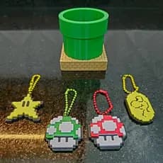 Tubo + Chaveiros Power UP Mario Bros