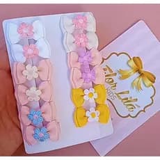 12 lacinhos para bebê/ lacinhos rn/ Mini lacinhos para bebê no bico de pato encapado e com borrachinha antiderrapante.