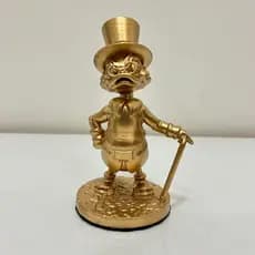 Tio patinhas dourado