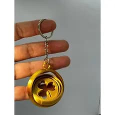 Chaveiro da Sorte 360 Dinâmica Um Amuleto Cinético em Dourado