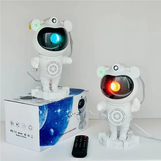 Projetor de Luz Astronauta Caixa de Som Bluetooth 2ª Geração: A Caixinha de Som Astronauta Bluetooth oferece uma experiência única! Com projetor estelar, luminária e a funcionalidade de caixa de som Bluetooth, proporciona criatividade e entretenimento. De