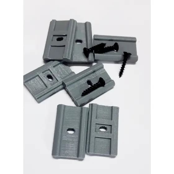 Fixador para trilho lateral e superior de porta sanfonada de pvc