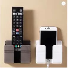 Suporte Multiuso De Parede Para Celular E Controle Remoto