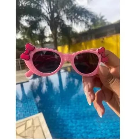 Óculos de sol infantil Rosa estampa bolinha com laço