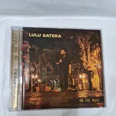 CD- LULU BATERA = ON THE ROAR ( USADO) LEIA A DESCRIÇÃO