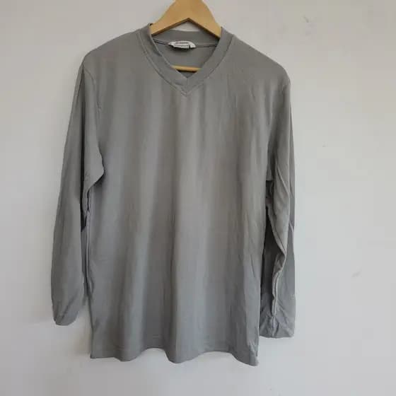 Primavera outono novo estilo versão coreana solta Casual moda redução de idade confortável decote em V cor sólida versão