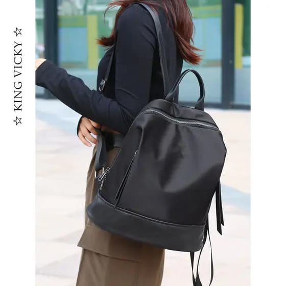 Mochila feminina saco novo estilo moda Oxford pano de náilon com nicho de couro genuíno Design grande capacidade saco de