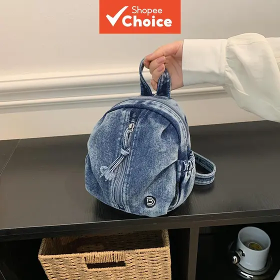 Bolsas femininas: Mini mochila vintage jeans lavada em azul, bolsa de ombro feminina casual com franja e zíper