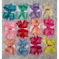 Kit com 12 Laços Infantis Estilo Boutique – Elegância e Cor para Cada Dia