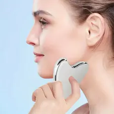 Massageador Gua Sha Aço Inoxidável – Firmador Facial + Bolsa para Viagem