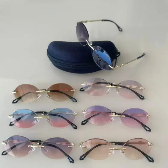 Óculos de Sol Feminino Oval Sem Aro UV400 – Estilo Elegante e Lente Degradê