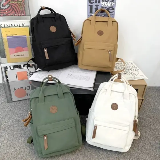 Mochila Escolar Casual de Lona Impermeável — Design Simples, Grande Capacidade e Estilo Versátil