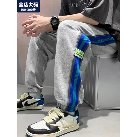Calças esportivas jovens dos homens primavera novo estilo estudante solto calças casuais gordura extra gordura extra gra