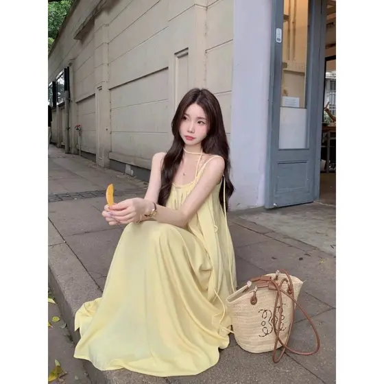 Vestido suspensor amarelo estilo férias à beira-mar verão temperamento elegante solto Casual vestido de praia vestido lo