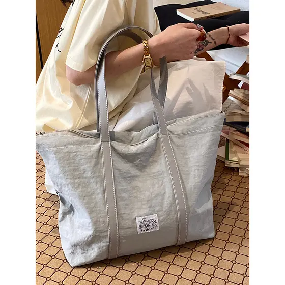 Bolsa de pano leve de grande capacidade feminina 2026 novo estilo solto bolsa de ombro simples bolsa All-Match