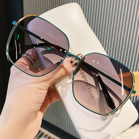 Óculos de sol novo estilo na moda feminino único rua tiro estudantes de viagem Anti-ultravioleta rosto grande mais magro