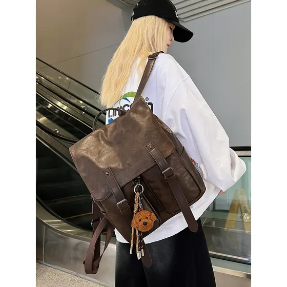 2025 novo estilo Retro aleta mochila masculino feminino estudante mochila de couro europeu americano versão coreana laze