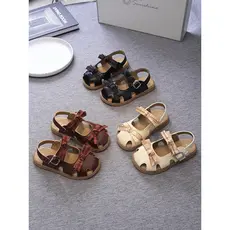 Meninas Baotou sandálias de sola macia oco sapatos romanos 2026 verão sapatos infantis bebê menina arco princesa sandáli