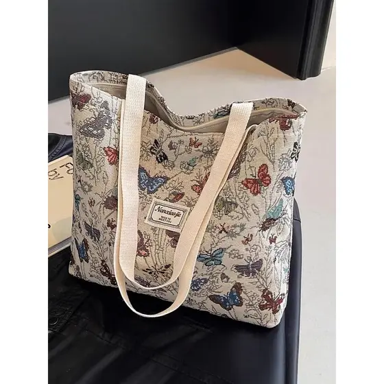 Bolsa de lona borboleta de grande capacidade 2026 novo estilo Commuter sacola feminina ins moda passeio de um ombro mamã