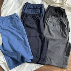 Temperamento T Estilo Simples!Cor sólida solto terno Shorts literário Retro Curling calças médias verão fino roupas masc